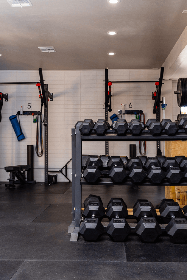 A spacious and well-equipped gym at Smith Performance Center, designed for strength training, rehabilitation, and performance enhancement.